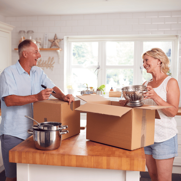 older couple packing the kitchen