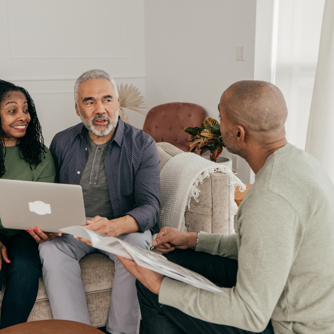 three people talking on the couch